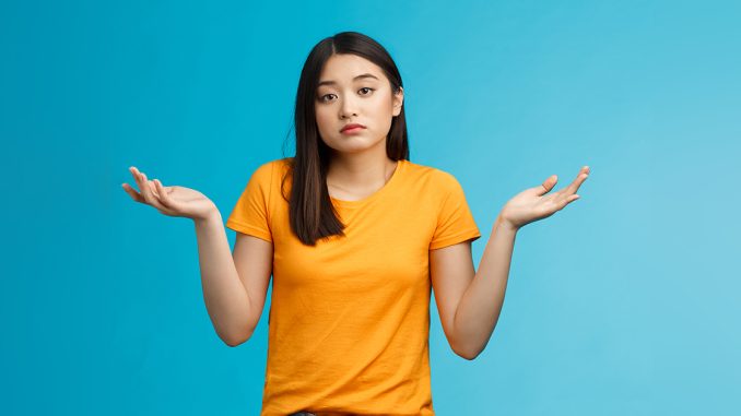 Shit happens. Indifferent absolutely careless female student not care how accident happened shrugging, look camera questioned unaware, hard answer, clueless how deal situation, stand blue background Advice You Should Never Ignore