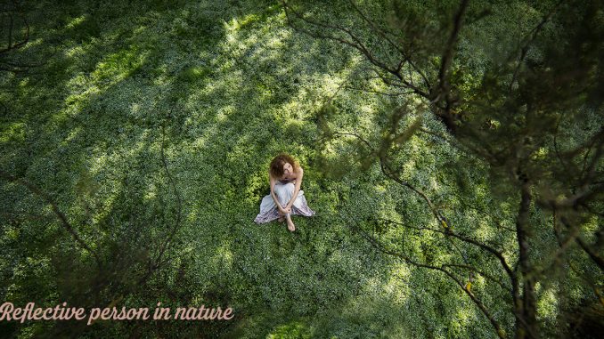 Reflective person in nature